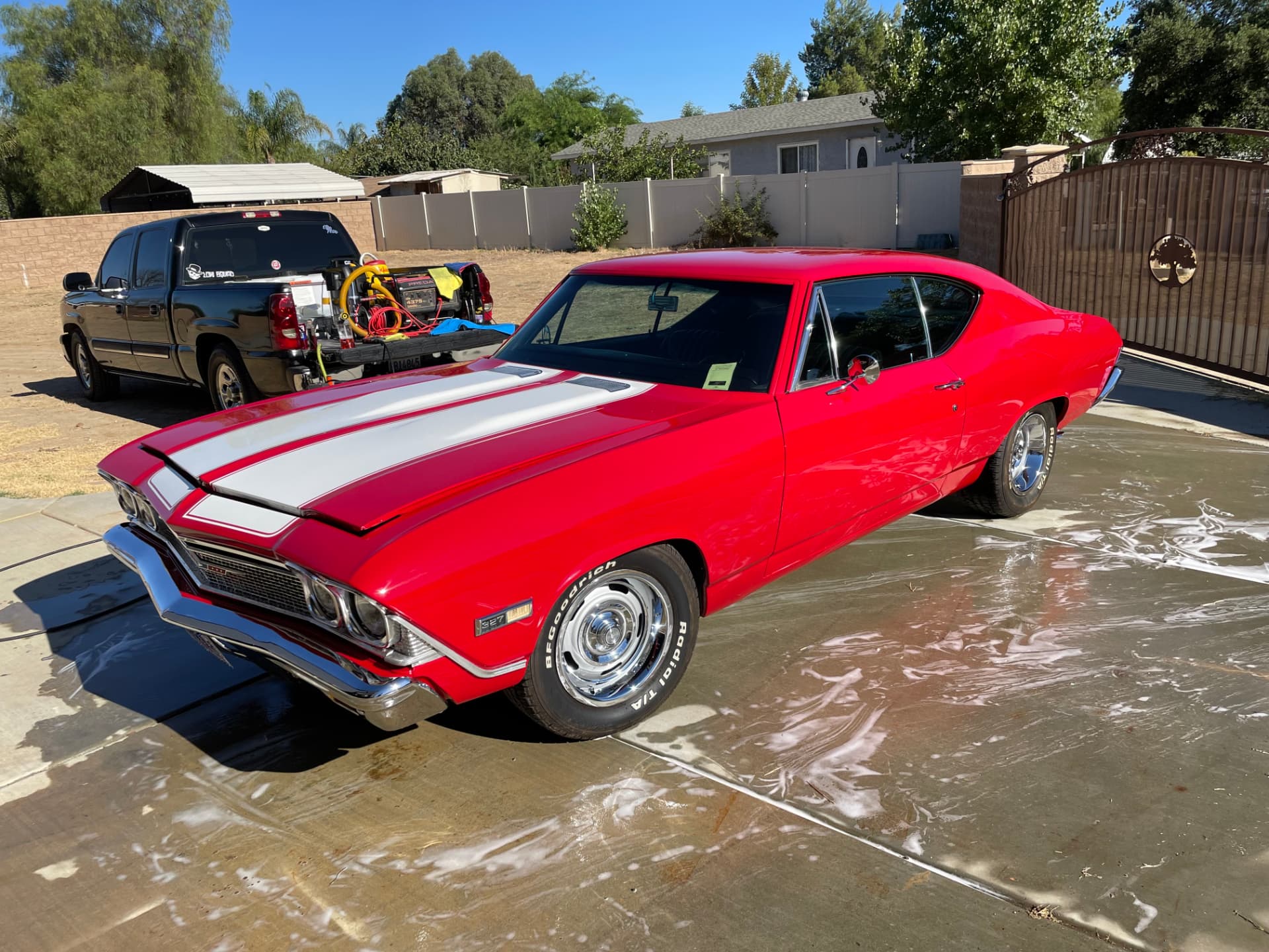 Red classic Chevelle, dusty before and glossy after a full wash and detail